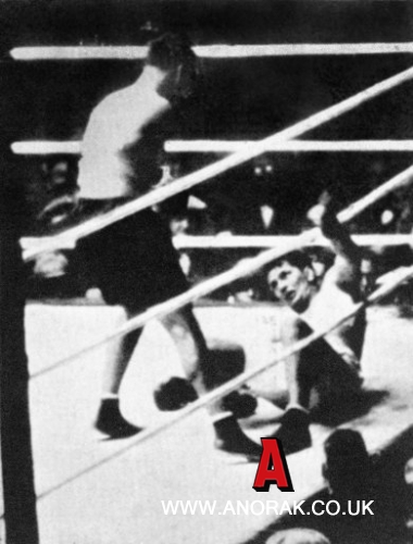 617021 - Heavyweight Champion Gene Tunney (r) looks up from the canvas after being floored by a shot from challenger Jack Dempsey (l) in the seventh round. Tunney allegedly stayed down for 14 seconds as referee Dave Barry spent five seconds persuading Dempsey to retreat to a neutral corner before beginning his count. Tunney recovered to win on points, but his victory was blighted by the controversy of 'The Long Count'