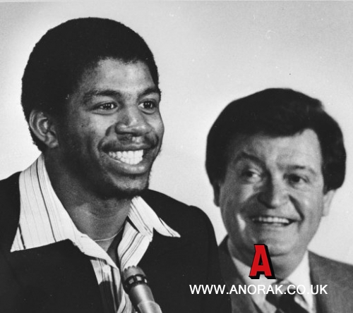 7182295 - Michigan State's 'Magic' Earvin Johnson, left, beams as Los Angeles Lakers assistant general manager Chick Hearn, right, smiles during a news conference in Los Angeles, Wednesday, May 17, 1979, during which the Lakers announced that they would take Johnson as the first pick in the NBA draft. (AP Photo/Brich)