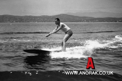 9869000 - Sir Oswald Mosley is surfboard riding, astern of a speed boat, one of the many delights to be enjoyed at Cap D'Antibes, France in 1930. Those members of society who are not grouse shooting are pretty sure of being found here, bathing in the lovely Southern sun, and the blue waters of the Mediterranean. Sir Oswald Mosley, who is holidaying at the cap with his family, enjoys a thrill in surf riding here. (AP Photo)