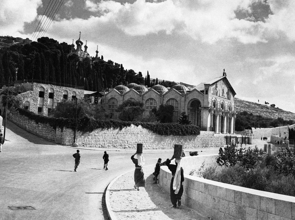 A scene on the Jericho road looking towards the multiple-domed Church of All Nations. Rising above it can be seen the Russian church of St. Mary Magdalen with its gilt cupolas, in Jerusalem, Israel, on Nov. 27, 1945. (AP Photo) Ref #: PA.10084994  Date: 27/11/1945 