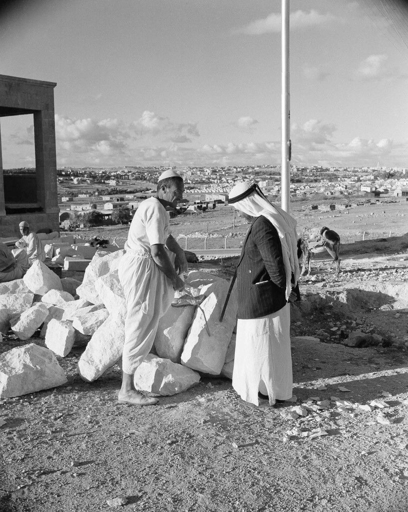 Two Arabs chat by the roadside with the ancient city of Jerusalem in the background, Nov. 28, 1947. (AP Photo/Jim Pringle) Ref #: PA.14713577  Date: 28/11/1947 