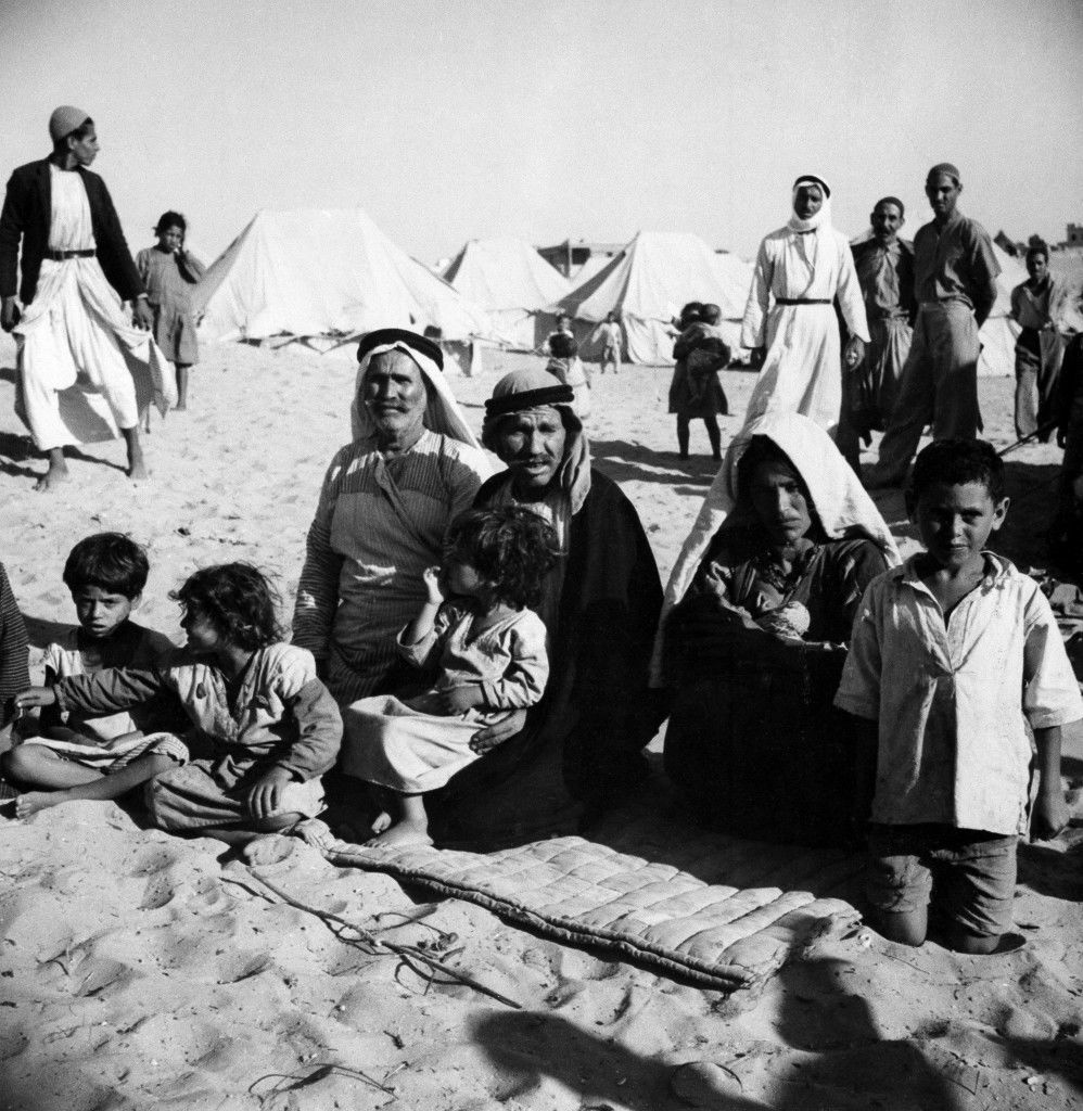 This family owned their own farm near Haifa. They fled when the British mandate ended and it became certain Israel would control the town. Today they are refugees in a camp near Gaza. The only possession they still have is a padded blanket. Location and date unknown. (AP Photo) Ref #: PA.18984382  Date: 01/01/1949