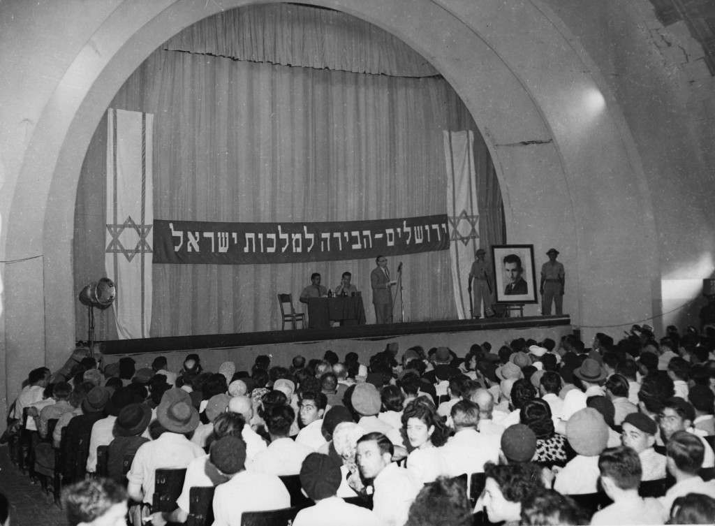 Beneath a banner proclaiming "Jerusalem, the capital of Israel" Stern Group leaders address a large meeting in the Holy City, Jerusalem, Palestine, August 1948. (AP Photo) Ref #: PA.5736828  Date: 01/08/1948