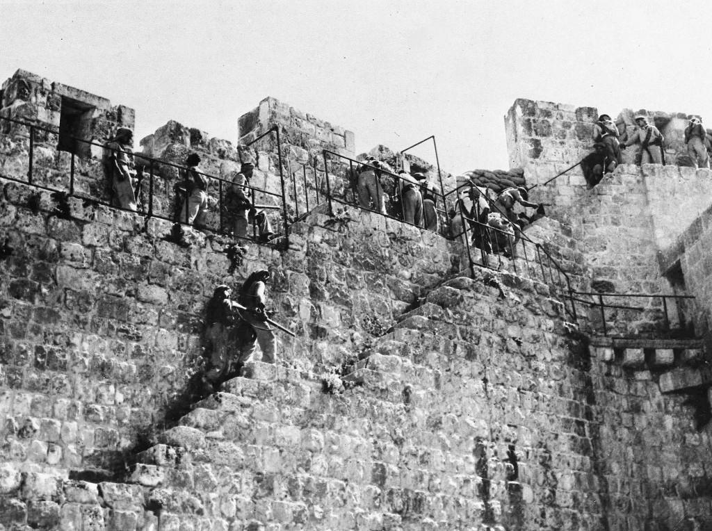 Arab Legion riflemen resume their front line positions along the battlements of the walls of the old city of Jerusalem, as the truce ends in Palestine, July 9, 1948. Jewish shelling has been concentrated on this sector since the end of the truce. (AP Photo) Ref #: PA.5736882  Date: 09/07/1948 