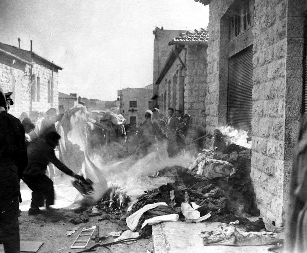 A crowd of arab demonstrators burn goods taken from Jewish homes in Jerusalem, Dec. 6, 1947, during the disturbances which broke out as the arabs staged a three-day strike against the partition plan. Jewish shops and homes in the quarter were attacked and some set on fire. (AP P hoto/Pringle) Ref #: PA.5737159  Date: 06/12/1947