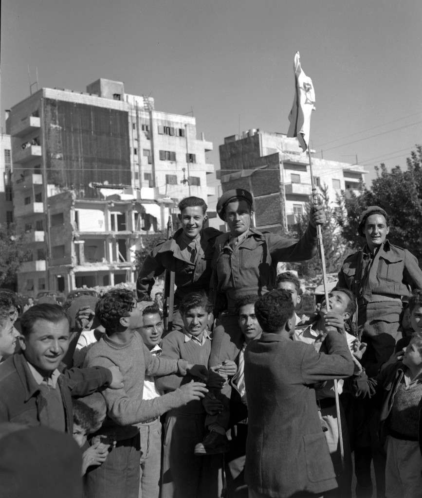 Jews who have been the enemies of the British for the past few years, have made up after hearing of the news of the declaration of the new Jewish State of Israel. Jews are seen hoisting British soldiers on their shoulders and holding the Israeli flag on Nov. 30, 1947 in Jerusalem. (AP Photo/Tom Pringle) Ref #: PA.5737169  Date: 30/11/1947