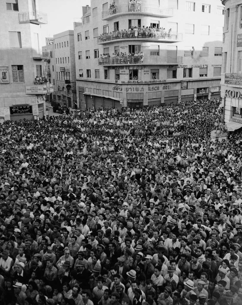 Some 4,000 people in Jerusalem listen to an address by Menachem Begin, from a balcony of the Tel Aviv hotel on Zion Square, August 11, 1948. (AP Photo) Ref #: PA.5737179  Date: 11/08/1948