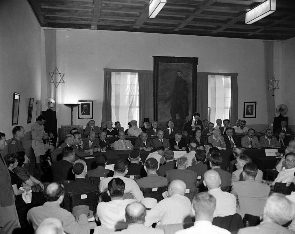 Members of the General Zionist Council meet for the first time since the establishment of the state of Israel, Aug. 28, 1948. The painting is of Theodore Herzl, founder of the first General Zionist Movement. Mr. S. Sprinzak (first name not available), chairman of the council, addresses the audience. (AP Photo) Ref #: PA.5737198  Date: 28/08/1948