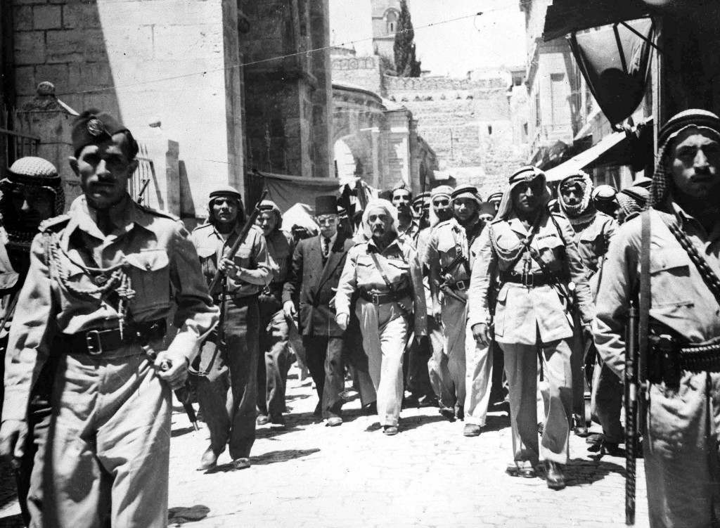 King Abdullah of Transjordan, centre with beard, leaves the Church of the Holy Sepulchre, Jerusalem, May 27, 1948, escorted by members of the Arab Legion. The Jewish sector of the old city fell to arab forces on May 28. (AP Photo) Ref #: PA.5737226  Date: 27/05/1948