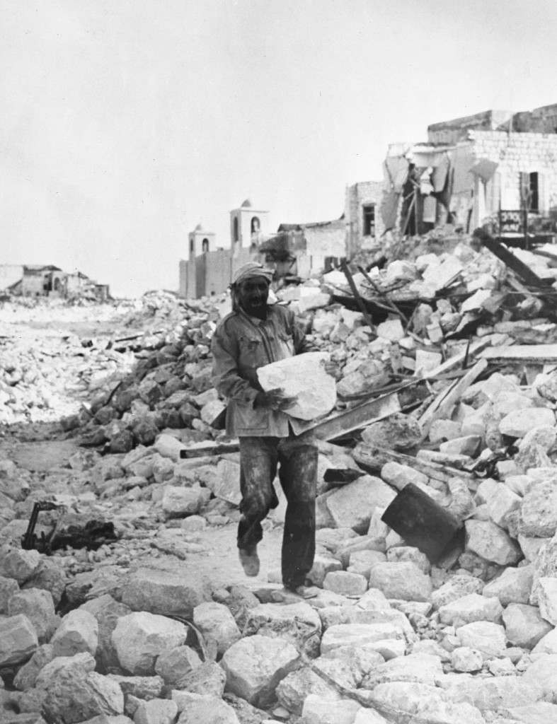 An arab workman is one of many who are assisting the Jewish authorities in Haifa, Israel, Nov. 8, 1948, in their great slum clearance scheme.(AP Photo/Staff/Pringle) Ref #: PA.5755039  Date: 08/11/1948 