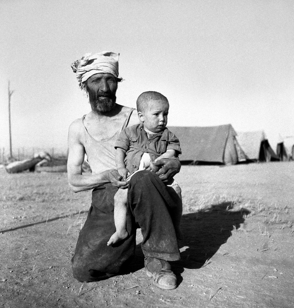 Israel Koperlov, 1 years of age, on the knee of his father, Chaim Koperlov awaiting sunset check by Legion guards on June 4, 1948 in Trans Jordan. (AP Photo/Daniel De Luce ) Ref #: PA.7091313  Date: 04/06/1948