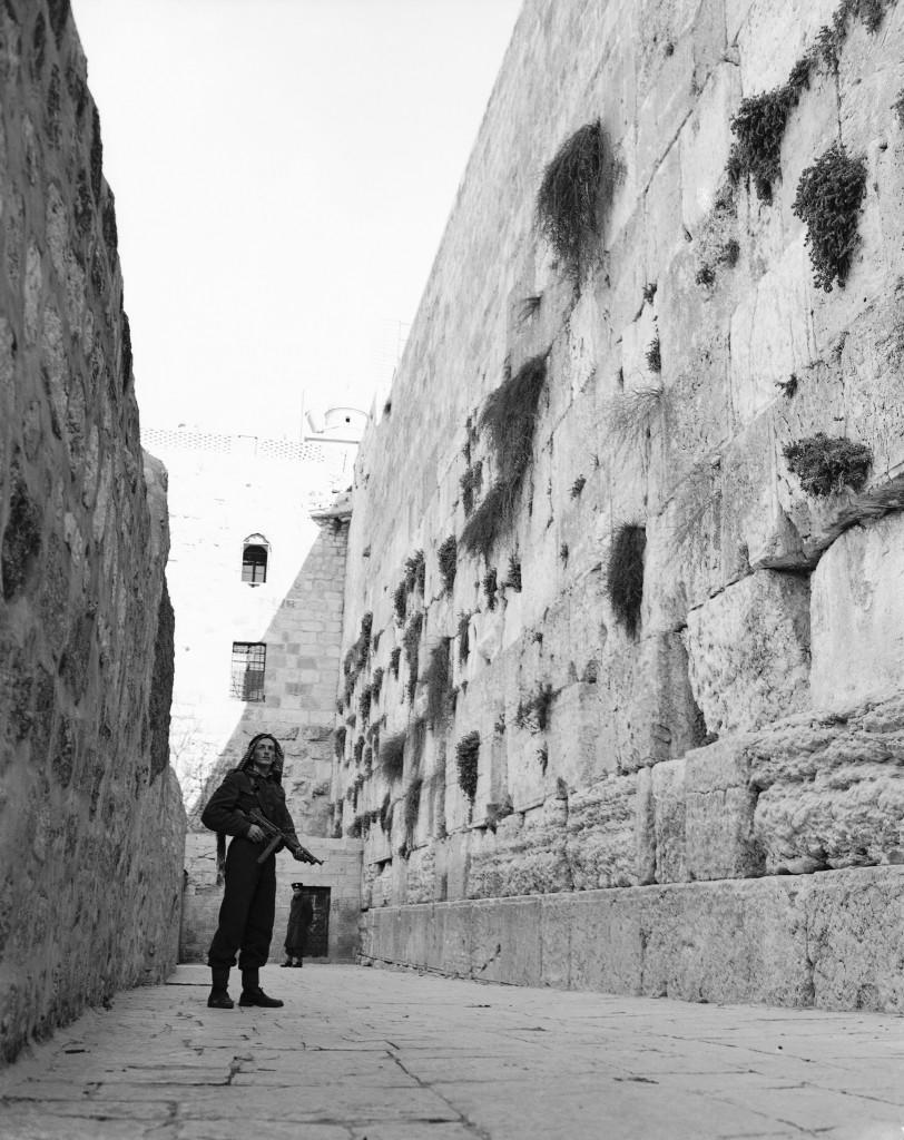 An Arab, armed with a sub-machine gun, stands guard at JerusalemÂ’s Wailing Wall on Feb. 23, 1948. Jews are being kept from this centuries-old holy place by Arabs for the first time since the Arab-Jewish disorders in 1939. (AP Photo/JP) Ref #: PA.7436344  Date: 23/02/1948