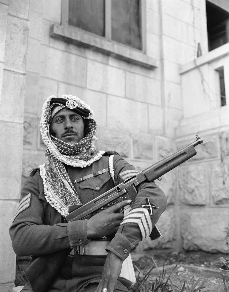 An Arab legion soldier fingers a machine gun as he stands guard in Jerusalem on Jan. 6, 1948 where his army is on loan to the British army to help out because of shortage of British soldiers in the holy land. (AP Photo/JP) Ref #: PA.7445783  Date: 06/04/1948 