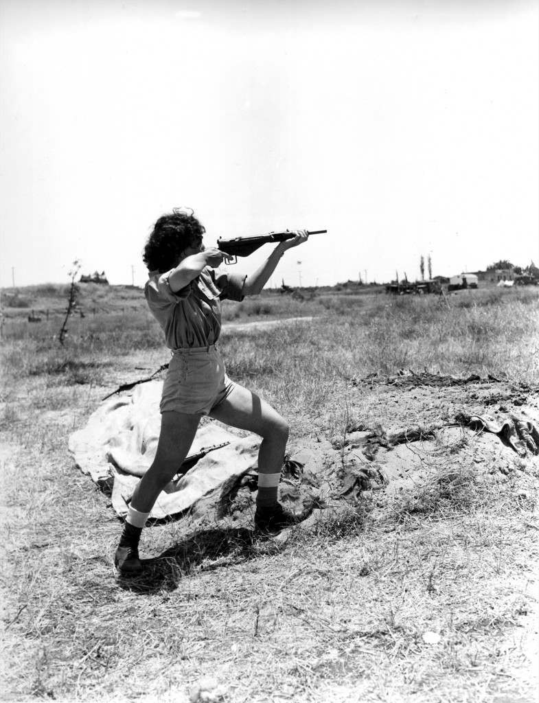 A female officer in charge of the range at the Hen women's corps camp near Tel Aviv, Palestine, gives a demonstration in the handling of a Sten gun on June 15, 1948 in the Arab-Israeli War. Although non-combatants, members the new women's Army in Israel are taught to use guns for defense. (AP Photo) Ref #: PA.8662596 Date: 15/06/1948