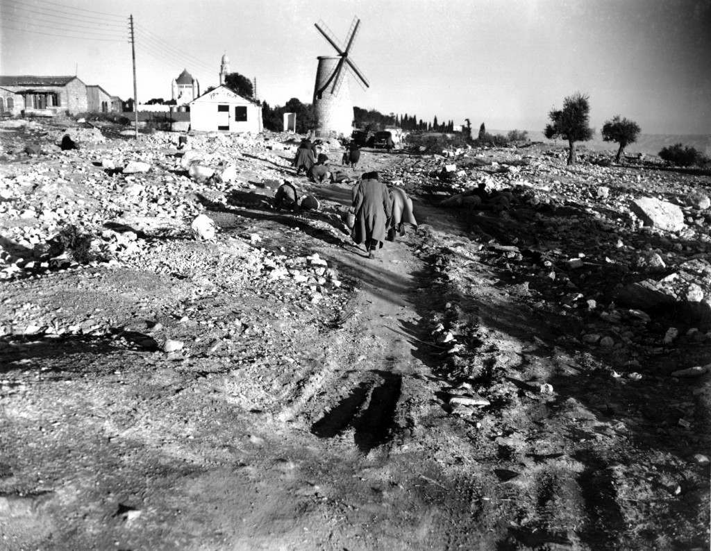 Jews crawl and run to dodge Arab snipers as they return to their homes in the village of Montefiore on the outskirt of Jerusalem after their day's work on Jan. 20, 1948. Palestinian Arabs fired from the walls of the old part of Jerusalem during conflict between Arabs and Jews during partition. (AP Photo) Ref #: PA.8673255  Date: 20/01/1948 