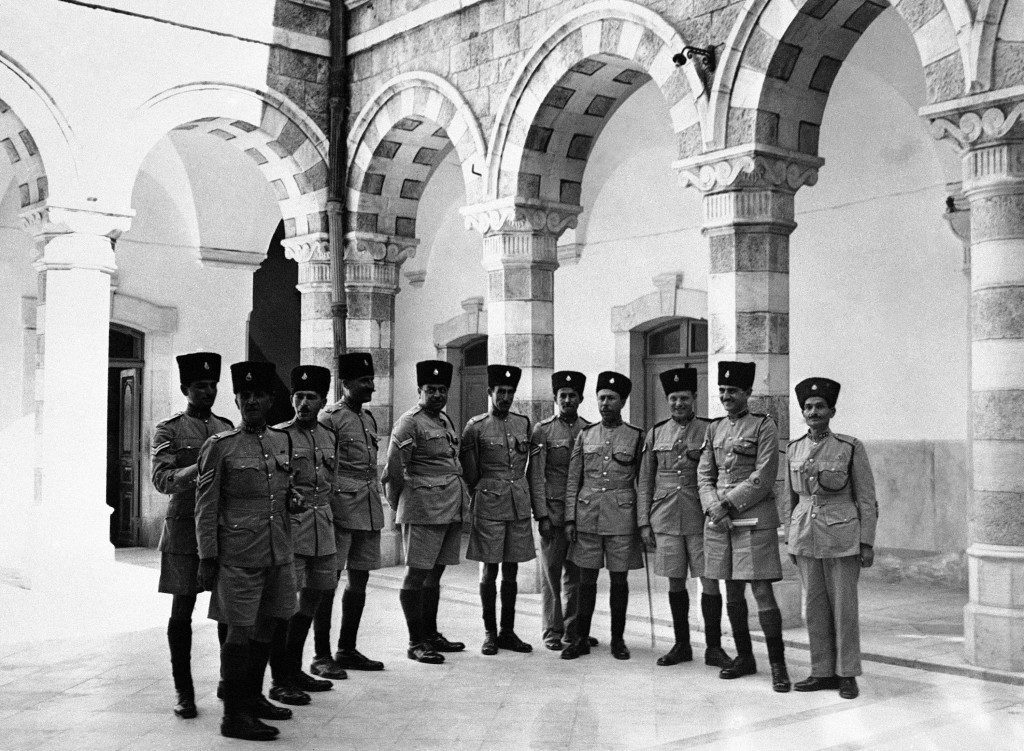 Young Arab recruits and volunteers from the British army are now undergoing intensive training at the Palestine Police Barracks in Jerusalem. An important part of the training for the young Arabs is with small arms and for the British, volunteers, specialized instruction in the types of weapons used by the Terrorists. A group of smartly dressed Arab members of the Palestine police, seen in the courtyard of their barracks in Jerusalem, on Nov. 15, 1945, which was formerly the palatial residence of a wealthy Jerusalem Arab. (AP Photo) Ref #: PA.9904571  Date: 15/11/1945