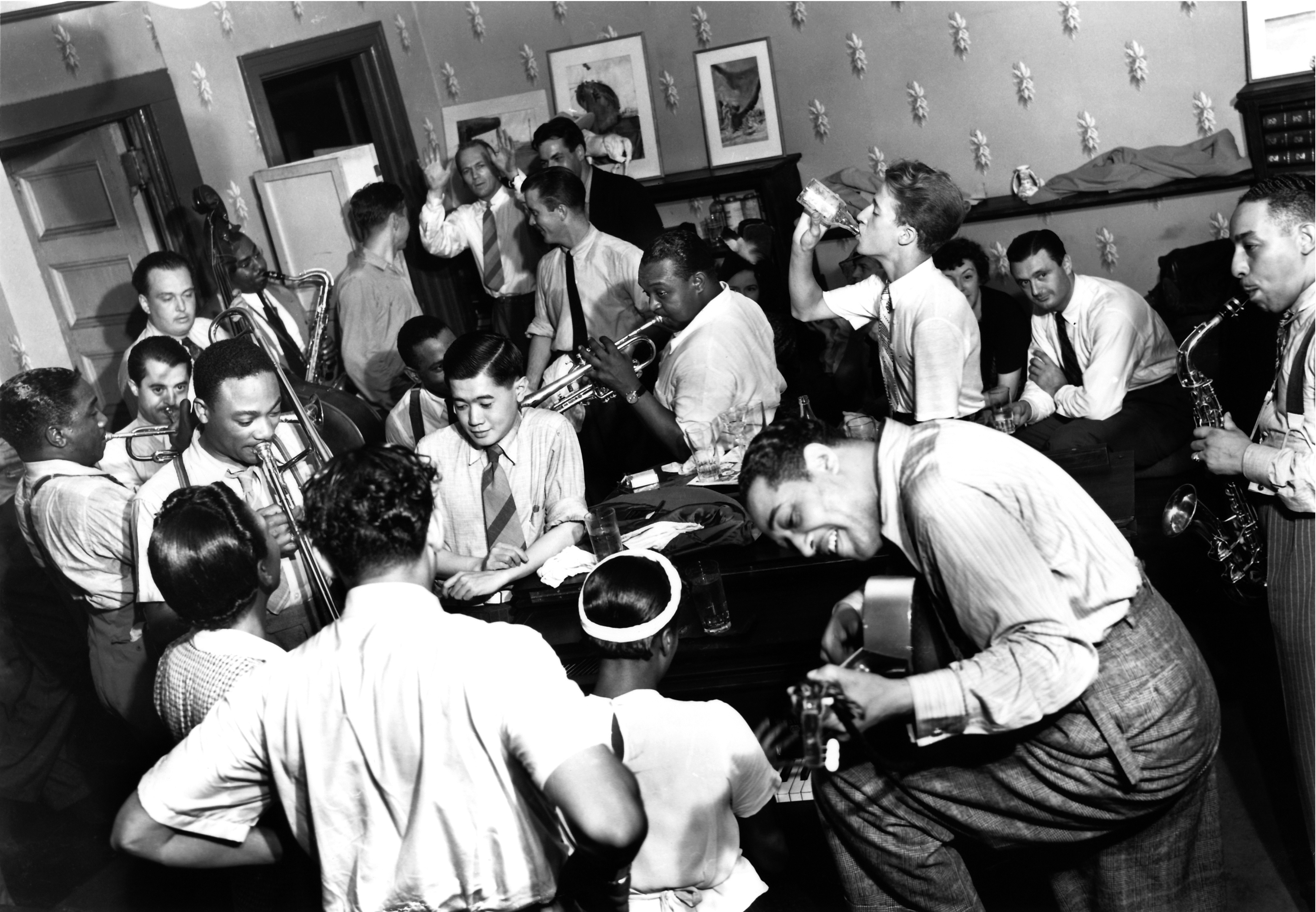 Cab Calloway, front row, back to camera with Ivie Anderson, Sister Rosetta Tharpe at piano; Duke Ellington on guitar, August 1939