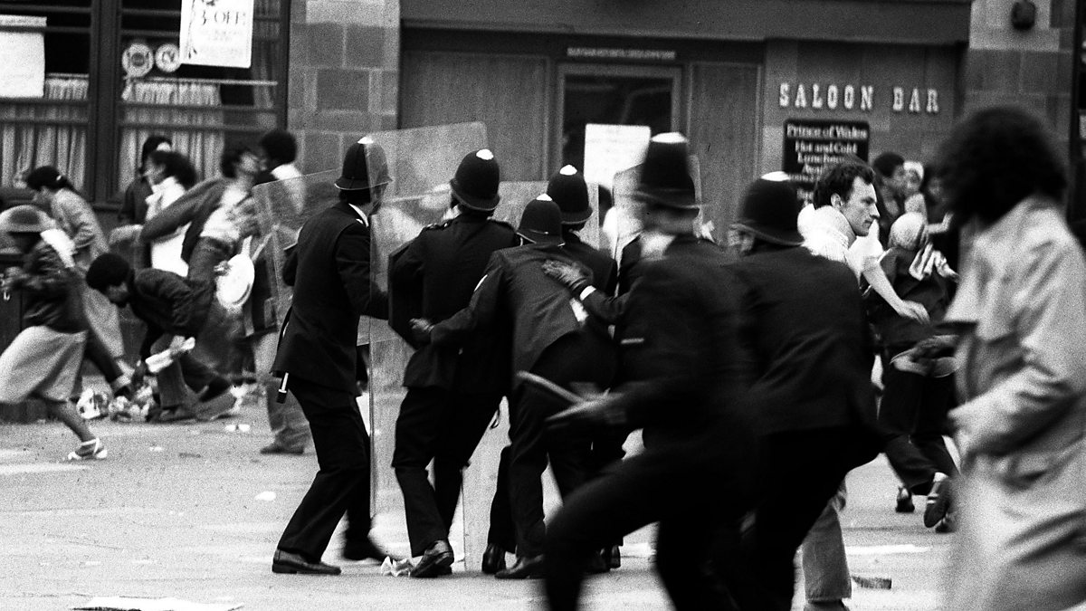 Armed with riot shields, police huddle together for protection as violence again flared near Lambeth Town Hall in Acre Lane, Brixton, south London, where between 200 and 400 black youths were on the rampage. Rioters smashed shop windows in the Brixton Road and began looting. Police squads moved in on foot and by van.