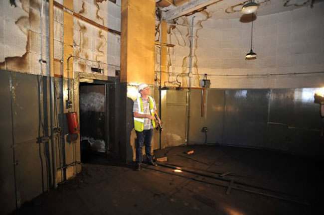 EMBARGOED TO 0001 AUGUST 7. Ministry of Defence property surveyor Julian Chafer, stands inside a circular room converted from a lift shaft in the former Brompton Road tube station, a disused station on the Piccadilly line between South Kensington and Knightsbridge which is owned by the Ministry of Defence and which has been put on the property market.