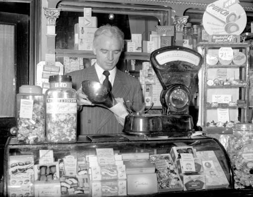 Football manager/player raich carter, serving in his sweet shop in George Street, Hull.