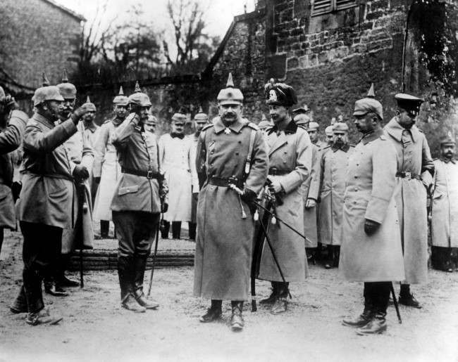 Kaiser Wilhelm II, Crown Prince Wilhelm and Prince Oscar (far right, looking down), standing in front of the Crown Prince's headquarters