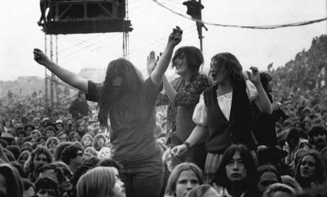 Music fans dance and sing to the Rolling Stones at a free concert at the Altamont Speedway near Livermore, Ca.