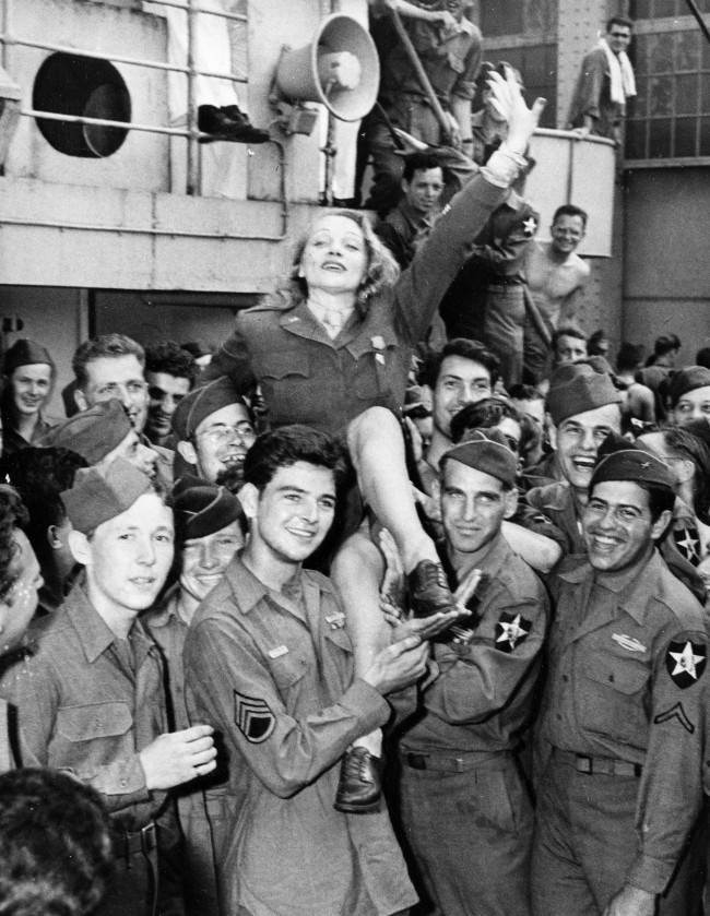 Movie actress Marlene Dietrich greets veterans on the Monticello after the ship docked in New York City on July 20, 1945 in World War II. (AP Photo)