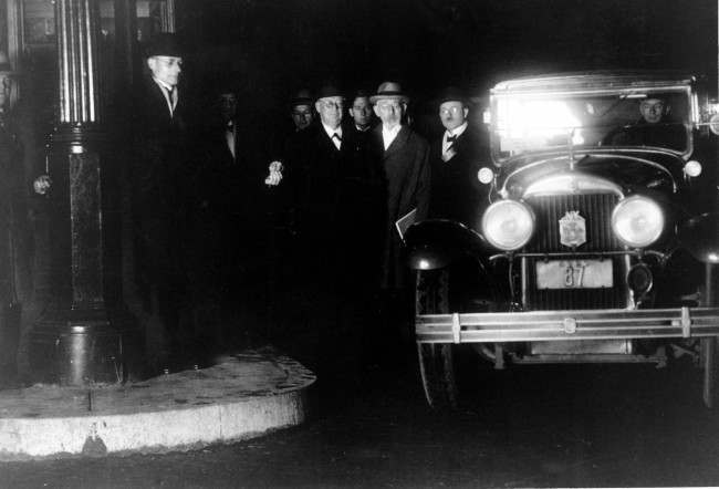 Tunnel Commission officials pose as they pay the first Holland Tunnel toll at midnight after the dedication ceremony in New York on Nov. 12, 1927. (AP Photo)