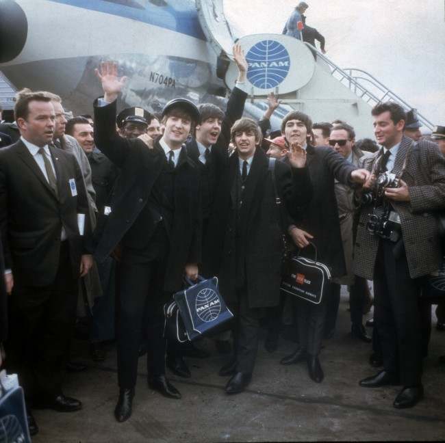 The Beatles arrive at New York's Kennedy Airport Feb. 7, 1964 for their first U.S. appearance. From left are: John Lennon, Paul McCartney, Ringo Starr and George Harrison. (AP Photo)