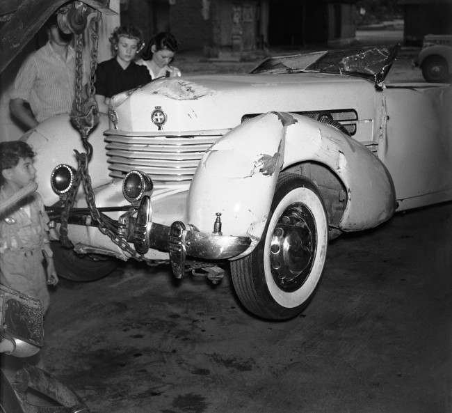 The big racing-type automobile in which Tom Mix cowboy actor, was killed in a highway accident near a Arizona on October 12 is picture after it was to intended in Florence garage on Oct. 16, 1940. Mix was pinned under the over turned partially wrecked car. An eye-witness said Mix was at high speed when his car hit a dirt before rolling over. (AP Photo/Harold Filan)