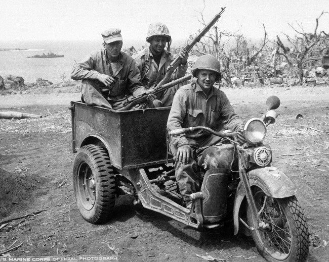 Japanese 3 wheel motorcycle repaired by U.S. Marines for own use. Photographed as action continued on Iwo Jima, Japan on April 16, 1945.