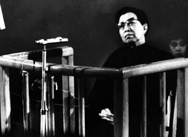 Jiang Qing, widow of former Chairman Mao, stands trial before a special court of the People's Supreme Court in Peking on Wednesday, Nov. 26, 1980. Jiang refused to confess and defiantly answered, "I don't Know at all," to charges that she plotted against the late Premier Chou En-lai and slandered his protege Deng Xiaoping, China's strongman