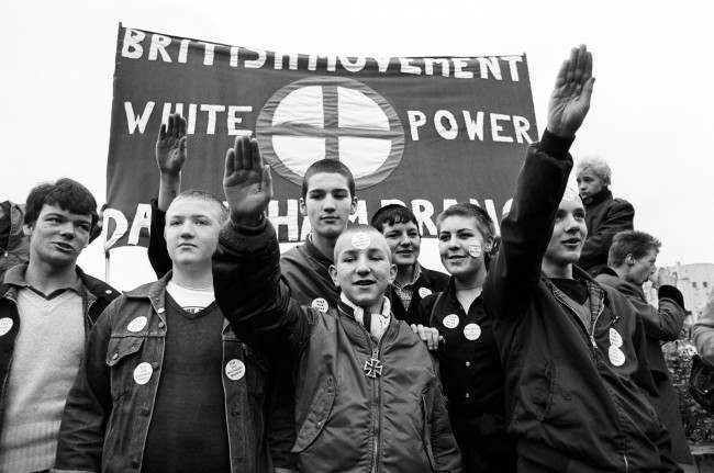 Members of the British Movement hold up a banner with 'White Power' and give Nazi salutes, during a march from Hyde Park, London, to Paddington Recreation Ground. The British Movement is a splinter group of the National Front. 