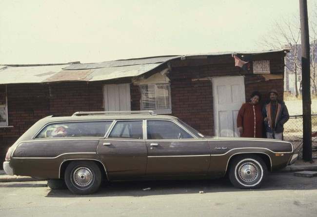 Shirley and Emuel Benton stand in front of the tarpaper shack they and their five children constructed in the Fort Greene section of Brooklyn, N.Y., Nov. 25, 1980. The Bentons, who were evicted from the housing project across the street after Emuel had to go on disability, lived in their station wagon while building their tiny home.