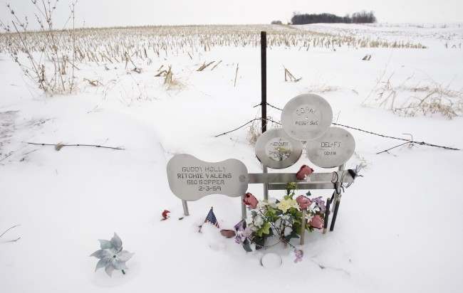 Flowers adorn a memorial, Friday, Jan. 9, 2009, at the spot where the plane carrying Buddy Holly, Ritchie Valens and J.P. "The Big Bopper" Richardson crashed killing all aboard, Feb. 3, 1959, near Clear Lake, Iowa.