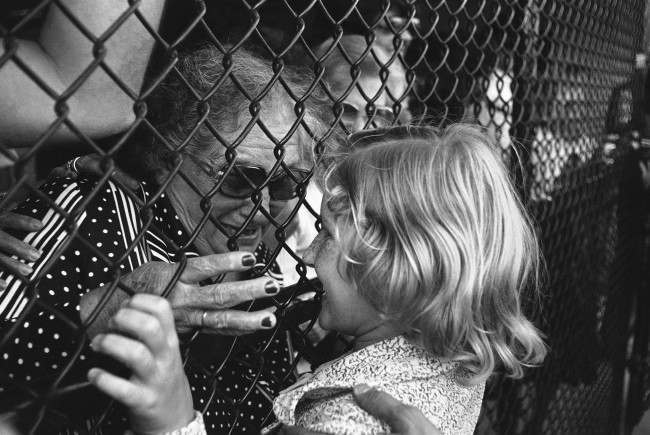 Mercedes Villaverde, 9 yrs., shares a tender moment with her grandmother Hilda after Mercedes arrived in Miami on Wednesday, Nov. 20, 1980. She and about 100 other Cuban refugees who legally immigrated to the US where reunited with loved ones after completing forms. 