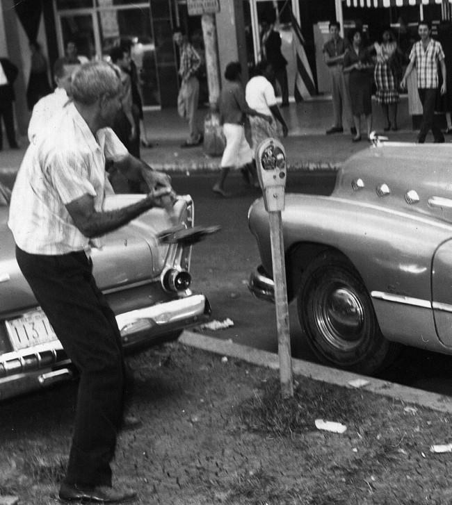 In this January 1959 picture, residents tear down a bus sign on the corner of Consulado and Neptuno Streets in Old Havana after revolutionaries gained the city. On Jan. 1, 1959, Dictator Fulgencio Batista fled Cuba and Fidel Castro took power.