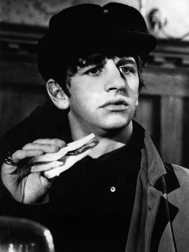 Drummer Ringo Starr is seen holding a sandwich in a scene from the Beatles' film "A Hard Day's Night," in May 1964. 