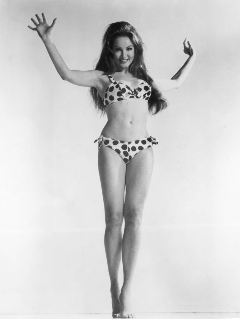 Full-length portrait of American actor Julie Newmar wearing a polka dotted bikini, 1960s. (Photo by Hulton Archive/Getty Images)