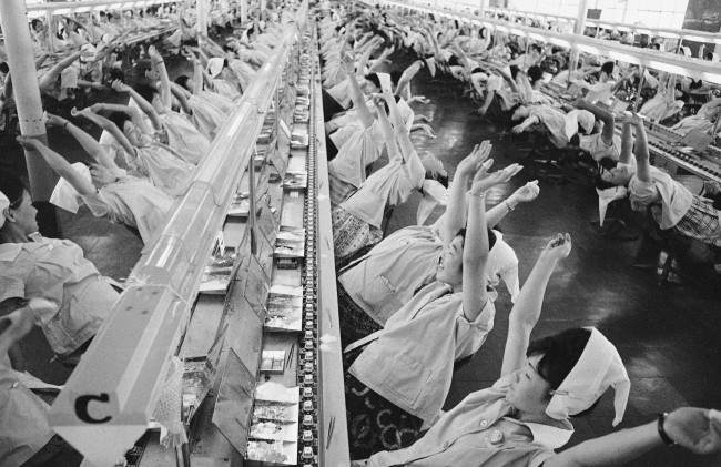 ÂStop working, take a deep breath, one, two, three, four.Â says a loud speaker. Then, youÂll see such a Âmass yawningÂ at the factory of Mitsumi Electric Company on the outskirts of Tokyo, Japan, shown May 7, 1963. Workers along assembly lines at the transistor radio parts maker take a brief break every hour in this unusual way. This was helped promote the company's productivity, according to the company officials. (AP Photo)