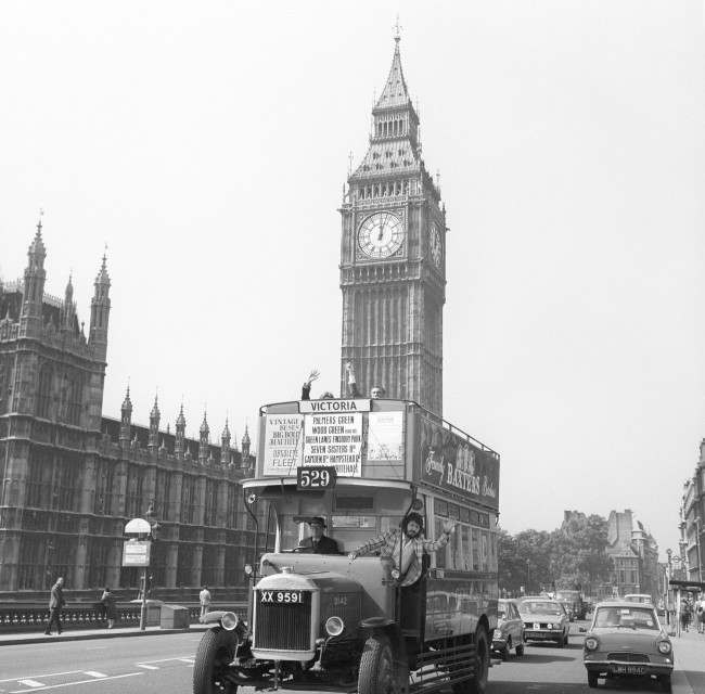 DJ Dave Lee Travis joins bus driver Bert Blower on a vintage London bus, which will form part of the London Autumn Fair along with 150 other vehicles. Date: 14/09/1973 