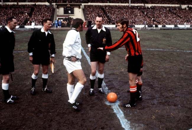 Manchester City captain Tony Book (r) shows West Bromwich Albion captain Doug Fraser (l) the result of the coin toss