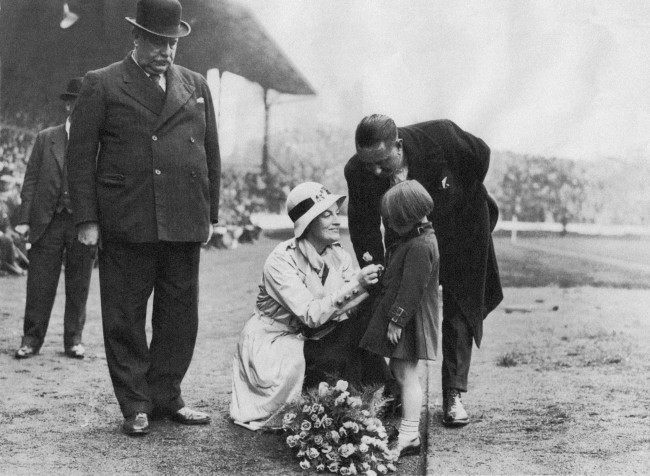 Soccer - League Division One - Chelsea v Newcastle United - Stamford Bridge A young girl presents singer Gracie Fields with a bouquet of flowers at Stamford Bridge before the start of the match. Ref #: PA.9529710  Date: 24/09/1932 