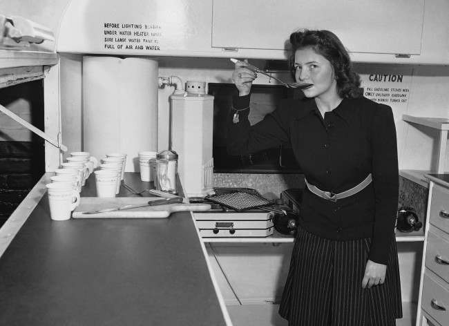A woman works in a mobile Kitchen, Feb. 15, 1941.