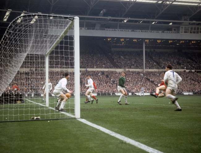 Liverpool's Ian St John (2nd right obscured, red shirt) scores an extra-time goal