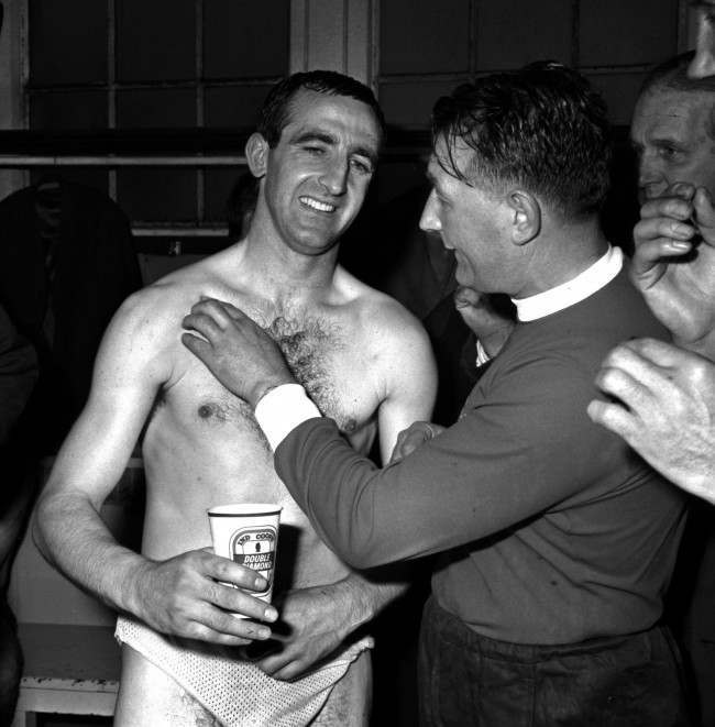 Liverpool trainer Bob Paisley gently probes the injured shoulder of left back Gerry Byrne in the dressing room at Wembley after their victory over Leeds United in the FA Cup Final. byrne played for all but one minute of the two hour game with a suspected fracture of his right collarbone. The injury happened, Byrne said, when he collided with Bobby Collins.