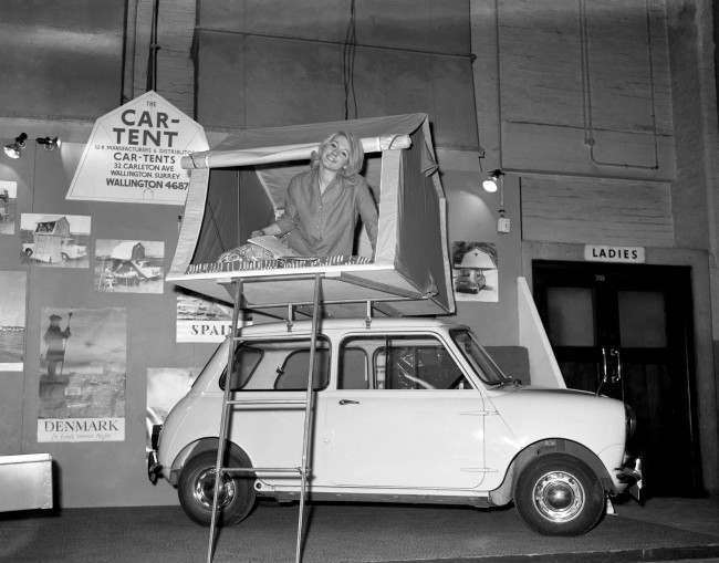 A model demonstrating a car tent. Ref #: PA.6394933 Date: 08/01/1963