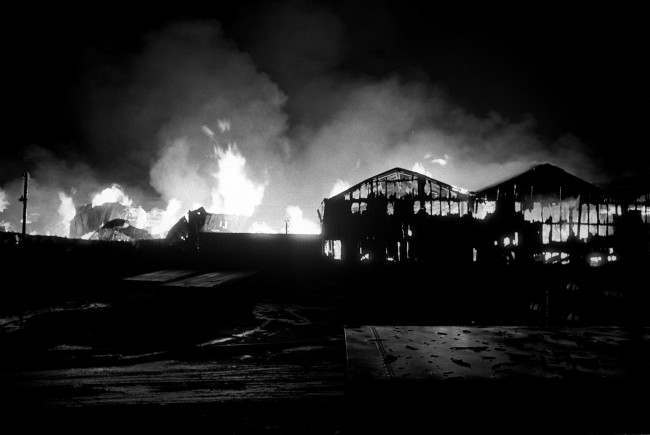 At the height of the blaze, flames leap from a 12-acre timber yard in Belfast's dockland. The fire raged for three hours before it was brought under control. Date: 10/02/1971 