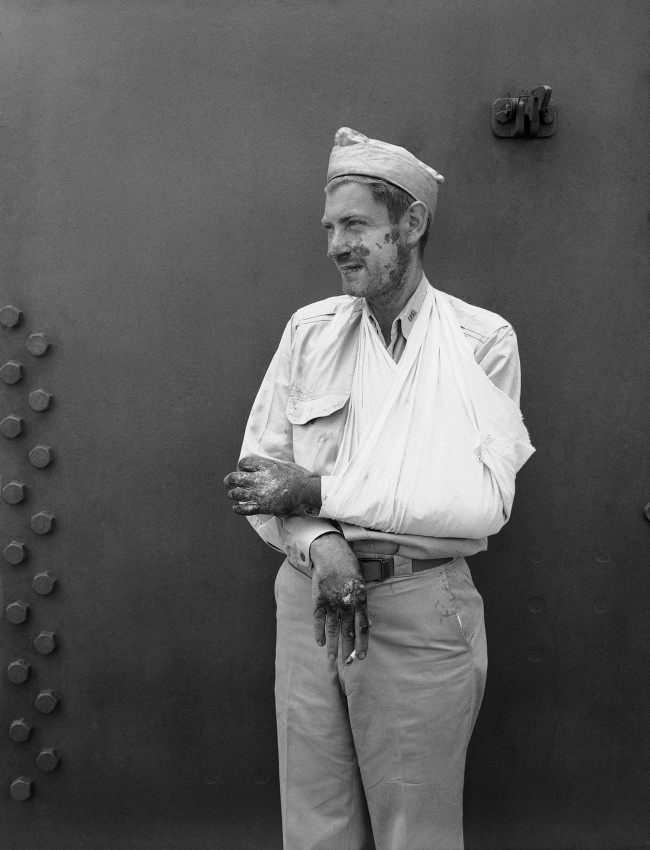 Charles H. McMurtry, Associated Press war correspondent shown Oct. 31, 1942, is recovering from burns received about the face and hands when a Japanese bomber crashed on the signal bridge of an aircraft carrier, a few feet from where he was standing, in the naval battle off the Santa Cruz Islands in the South Pacific on October 26.