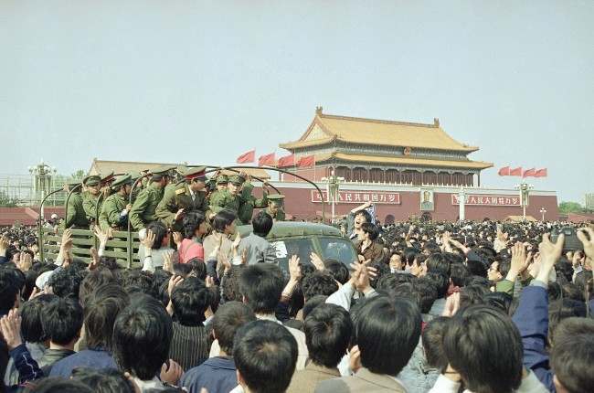 Chinese marchers are jubilant as they surround and stop an army truck at Tiananmen Square, April 27, 1989 in Beijing. (AP Photo/Mark Avery)